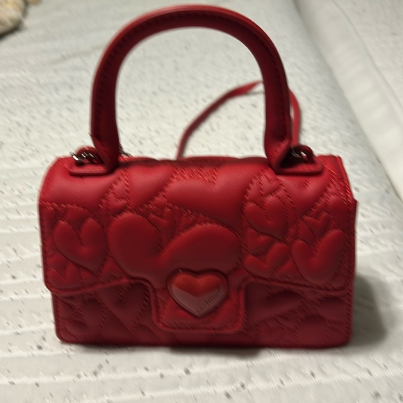 Betsey Johnson Handbags - Betsey Johnson Red Crossbody Bag nwot 8 X5 size. Pretty red purse with chain.